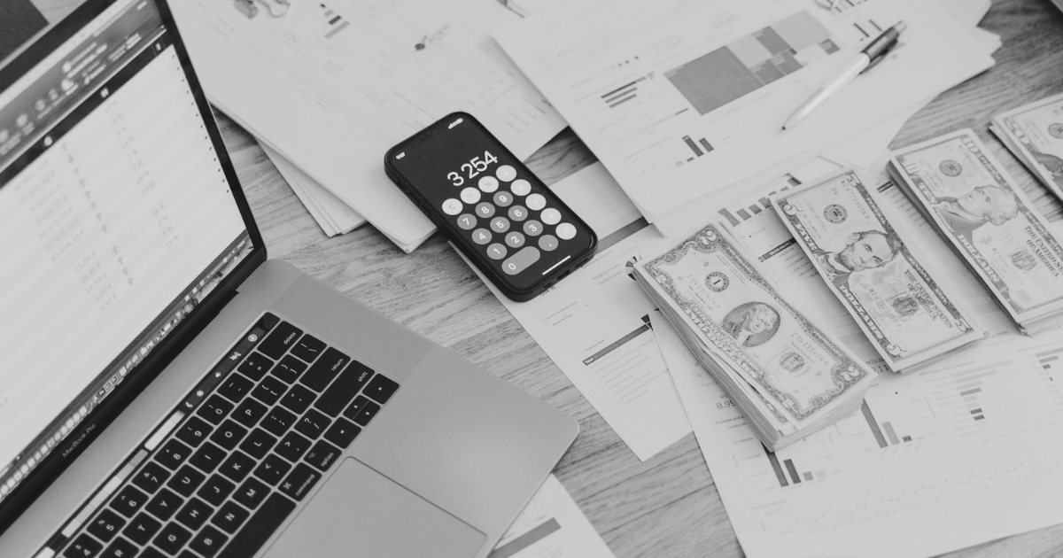 Calculator and documents on a desk representing the hidden cost of a WordPress rebuild quote