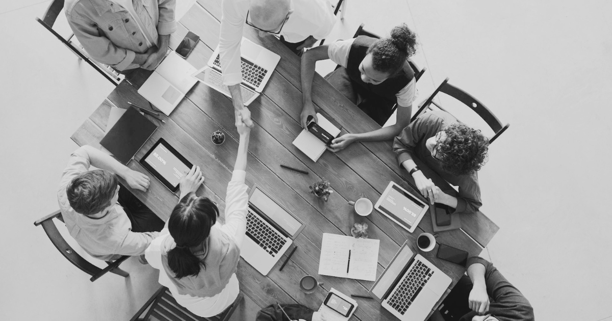 Business handshake representing the false promise of free WordPress proposals and blind estimates