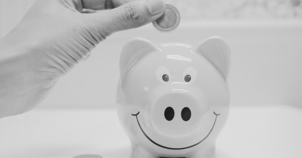 Money on a table representing the hidden long-term cost of a cheap WordPress build