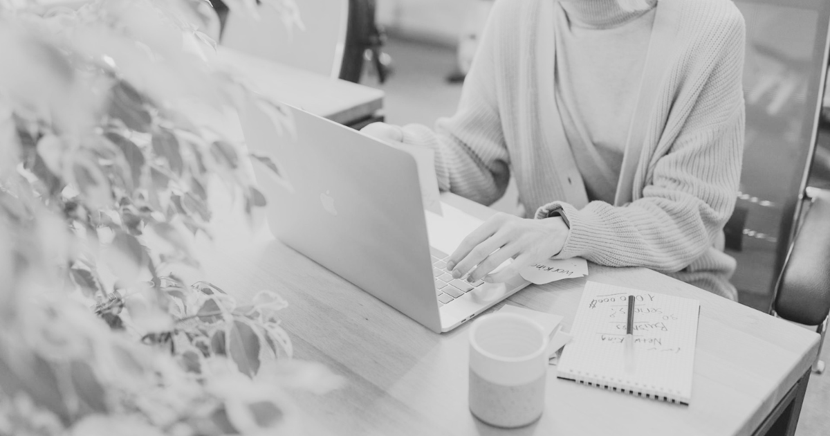 Person waiting at a laptop representing WordPress performance problems and slow page load times
